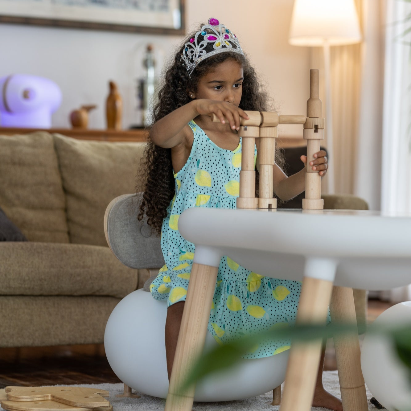 Girl playing with wood pieces